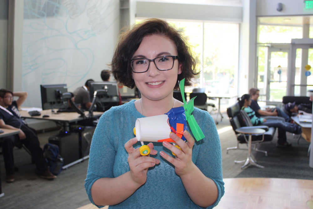 Homer High School senior Eryn Gillam shows off a motorcar created by her and her teammates during an engineering lab activity at the ANSEP Accerlation Academy at University of Alaska Anchorage.