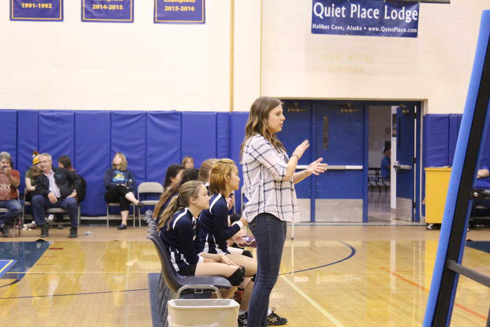 Kristie Mastre, the new head volleyball coach for Homer High School, claps as she watches a JV game during the Homer Jamboree tournament on Saturday, Aug. 20. Mastre is a Homer High graduate who played varsity volleyball during her time as a Mariner.-Photo by Anna Frost, Homer News