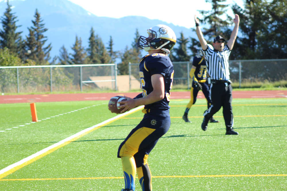 Mariner Jack Heimbold scores the first Homer touchdown of the game in the fourth quarter with a 5-yard gain after receiving a pass from Jaime Rios.