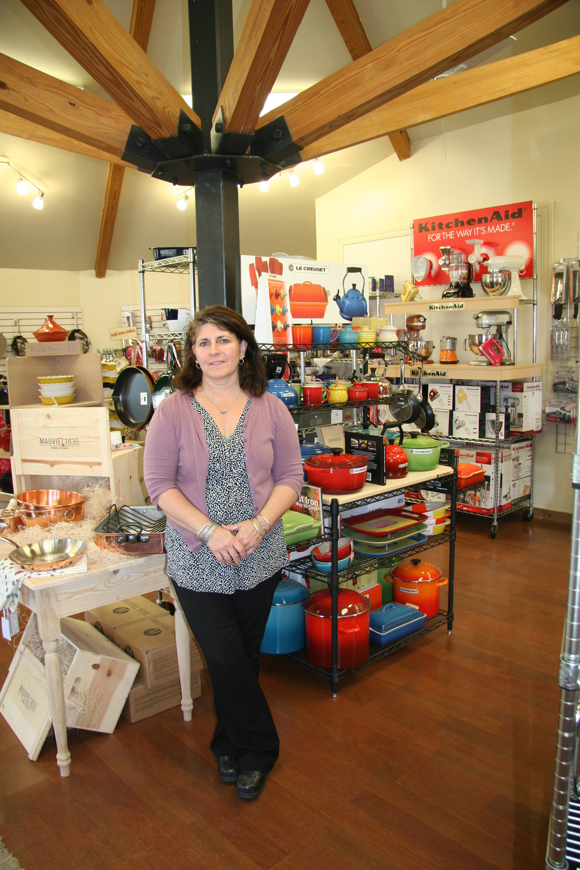 Janie Buncak stands amid the wares at her new kitchen boutique. The Classic Cook opened July 18 at 158 W. Pioneer Ave.-Photo by Toni Ross