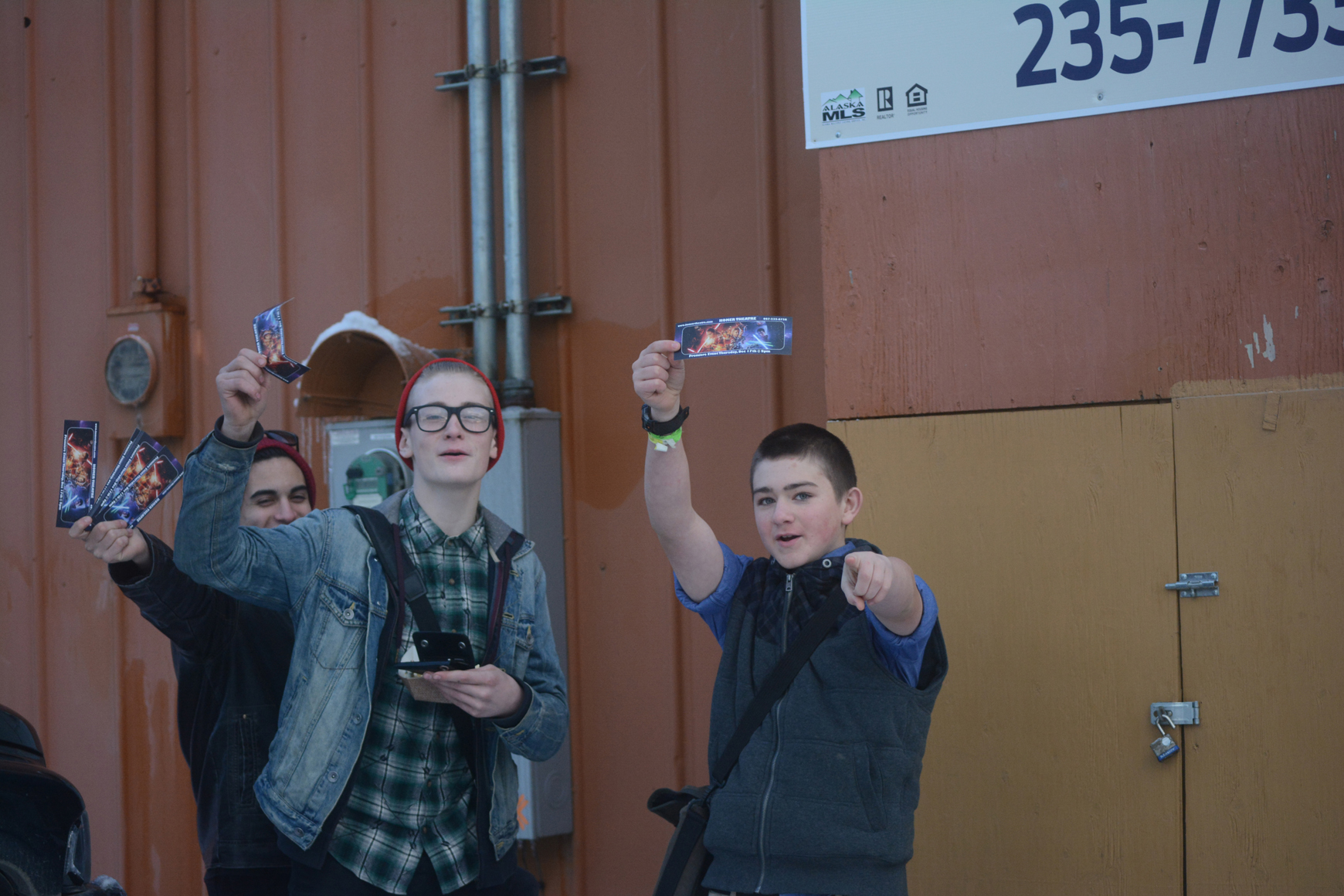 Simon Shelton, Josiah Coe and Angelo Amarello show off their advance tickets to the first weekend showing. The guys had waited in line an hour last Thursday to buy their tickets.-photo by Michael Armstrong