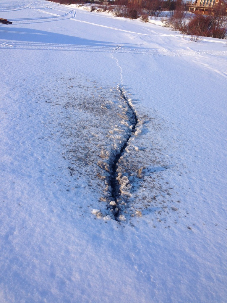 After the quake on Jan. 24, John Chapple III photographed this crack in ice at Caribou Lake.-Photo by John Chapple III