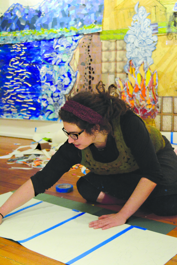 Desiree Hagen works on her installation, “Seven Years,” last Friday at Bunnell Street Arts Center.-Photo by Michael Armstrong, Homer News