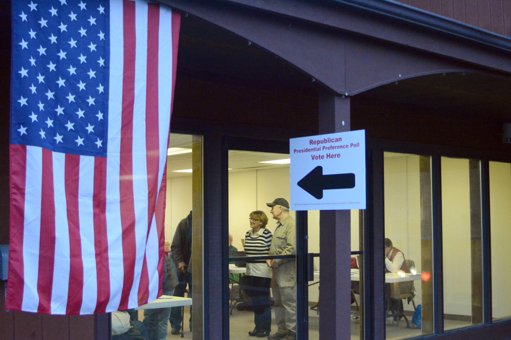 Sandy and Ralph Crane greet voters at the Trailside building in Homer on Tuesday for the state Presidential Preference Poll. About 300 people voted in the first three hours of polling. Texas Sen. Ted Cruz won in District 31 with 38.4 percent, and New York businessman Donald Trump was second with 36.6 percent. Dr. Ben Carson was third with 12.3 percent.-Photo by Michael Armstrong, Homer News