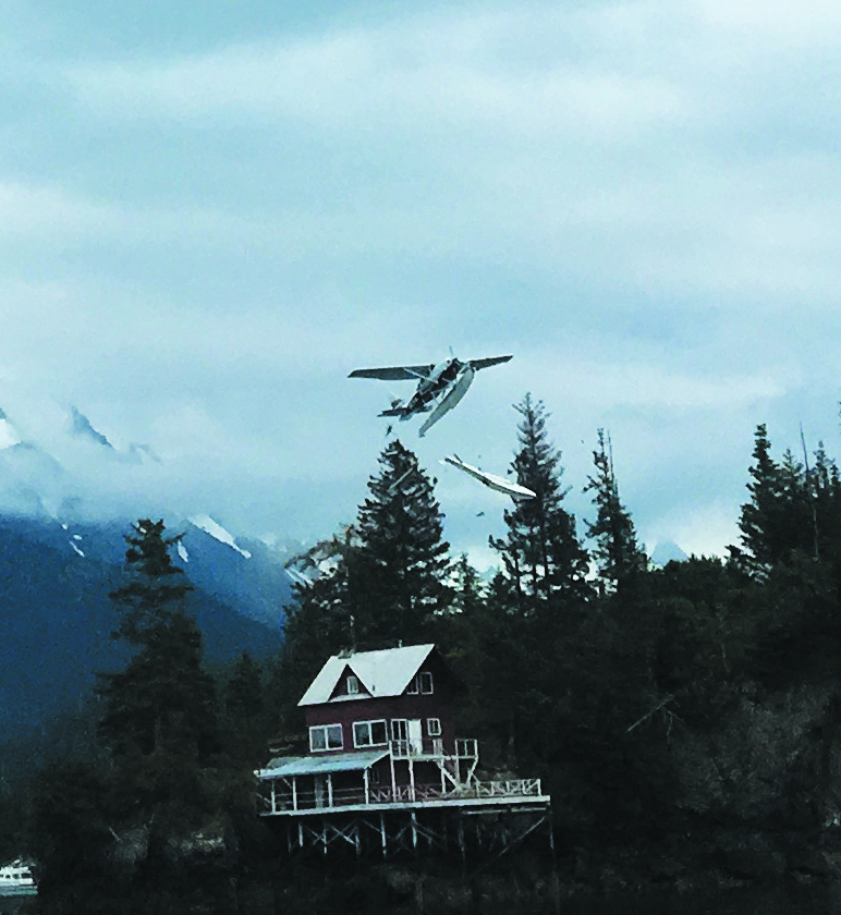 A photo taken by Dolores Wilber, a visitor from Chicago, shows Alice Rogoff's Cessna 206 as it loses its starboard float. The float appears to have come loose after the plane clipped a tree. Wilber took the photo from the Danny J.-Photo by Dolores Wilber