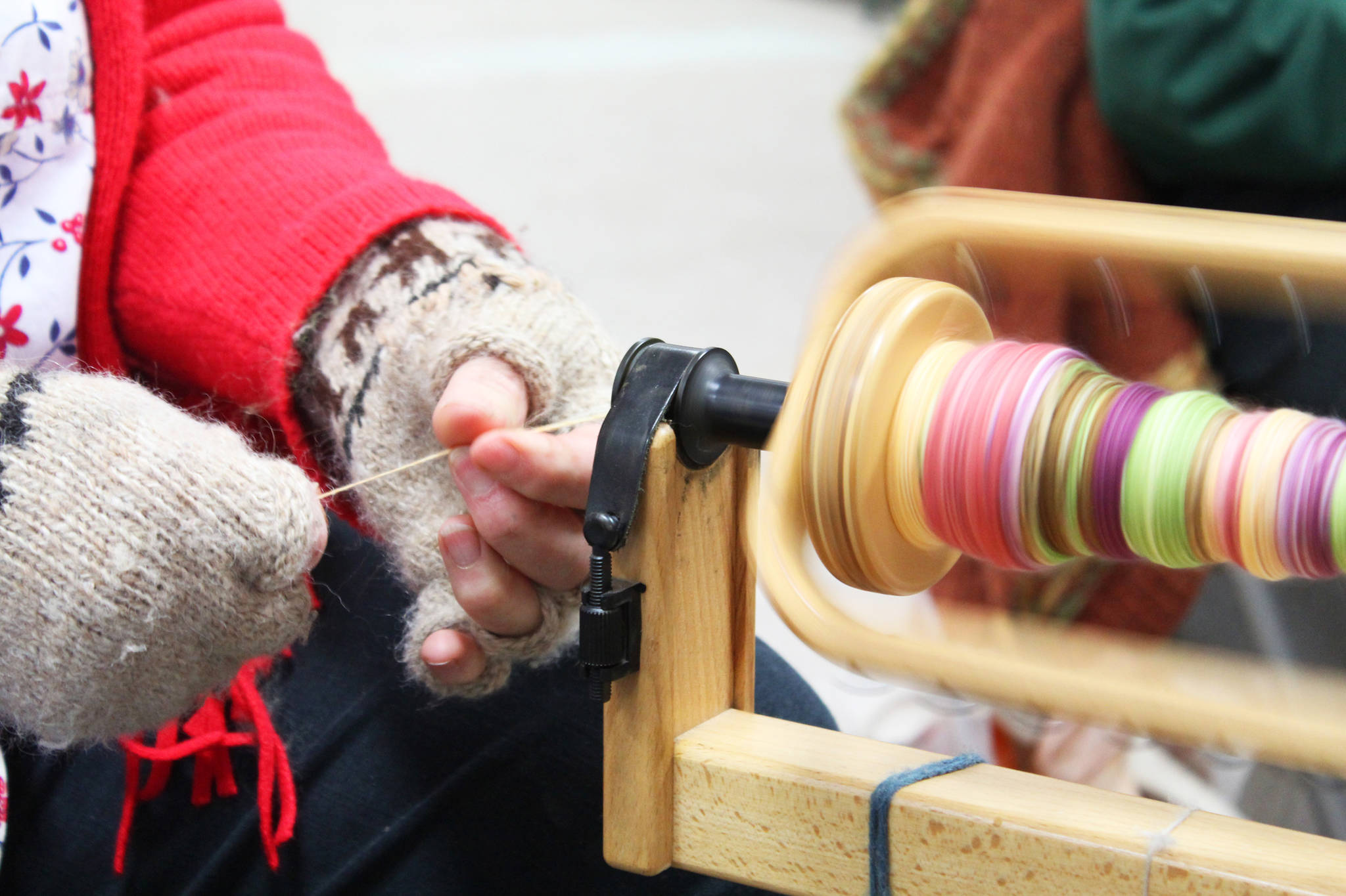 Lisa Lambert, a member of the Fireweed Fiber Guild, spins yard Friday, Aug. 18, 2017 at the Kenai Peninsula Fair in Ninilchik, Alaska. Members of the guild had tables and information at the fair and demonstrated yarn spinning from many kinds of natural fibers. (Photo by Megan Pacer/Homer News)