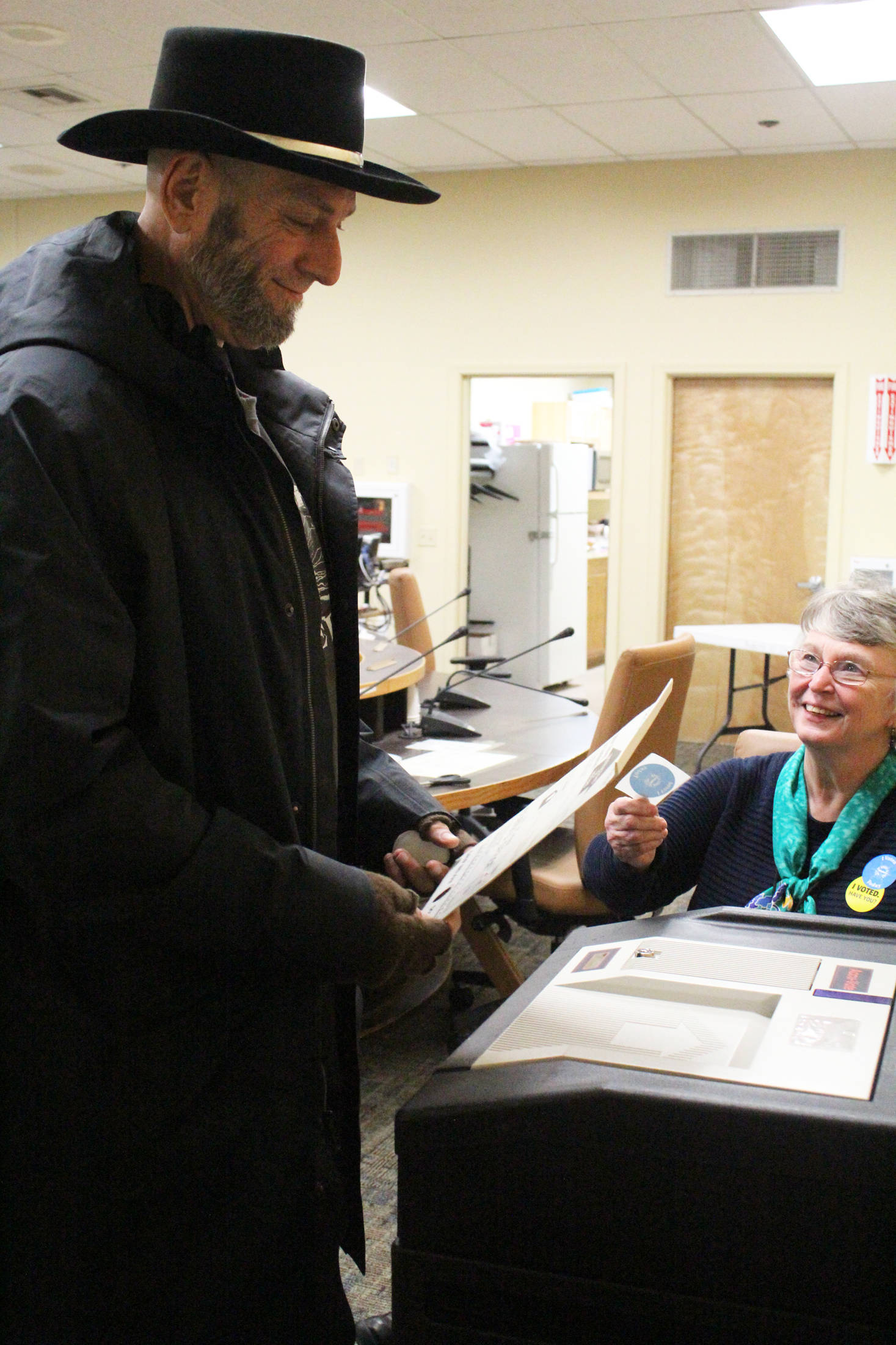 Homer resident Scott Owens casts his vote during the municipal election Tuesday, Oct. 3, 3017 at Homer City Hall in Homer, Alaska. (Photo by Megan Pacer/Homer News)