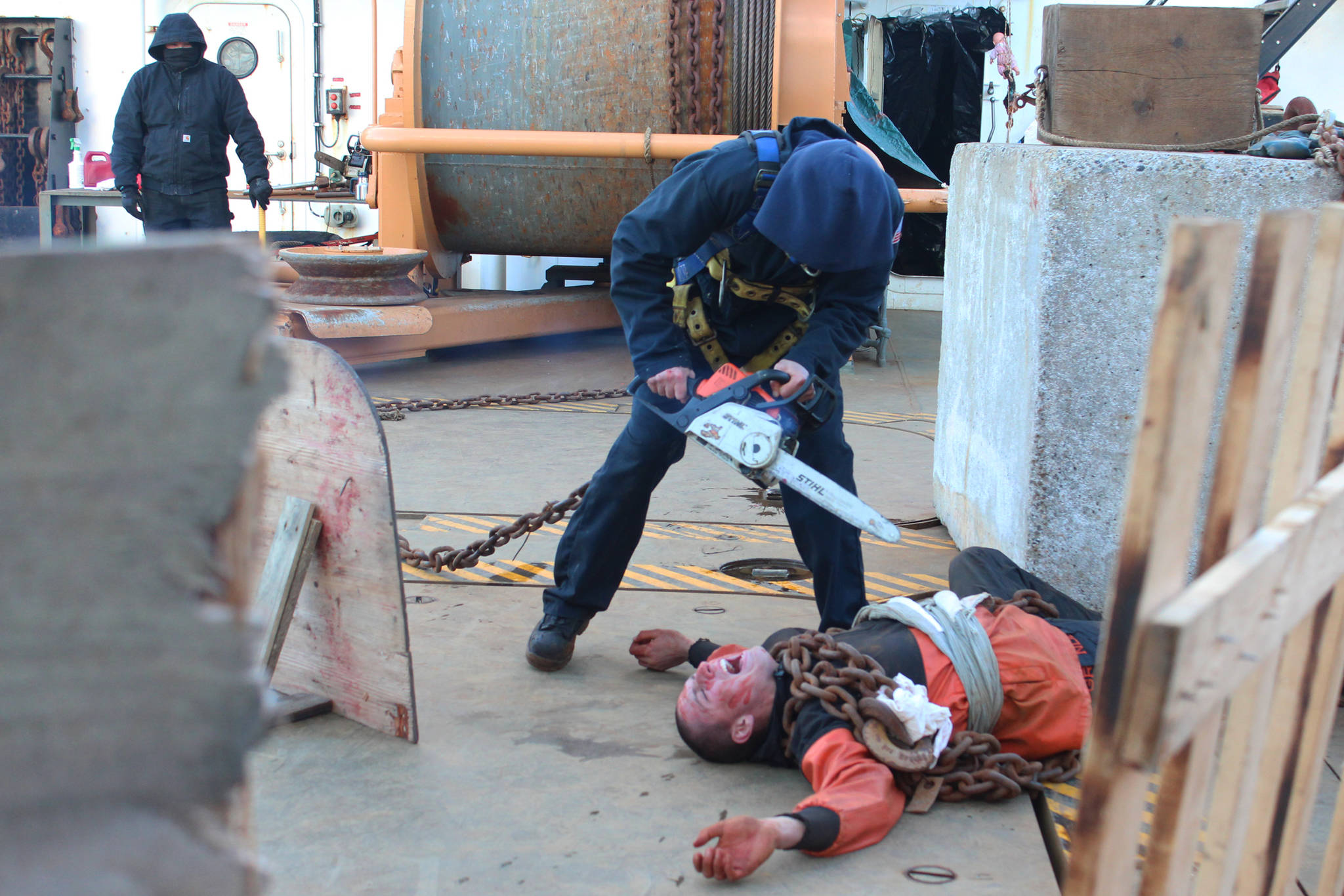 Tyler Partin pretends to eviscerate fellow crew member Ben Bergeron during this year’s Haunted Hickory aboard the U.S. Coast Guard Cutter Hickory on Thursday, Oct. 26, 2017 in Homer, Alaska. Hundreds of residents young and old line up to have the living daylights scared out of them by the Hickory crew and their families, who spend nearly two full days decking out the ship. (Photo by Megan Pacer/Homer News)