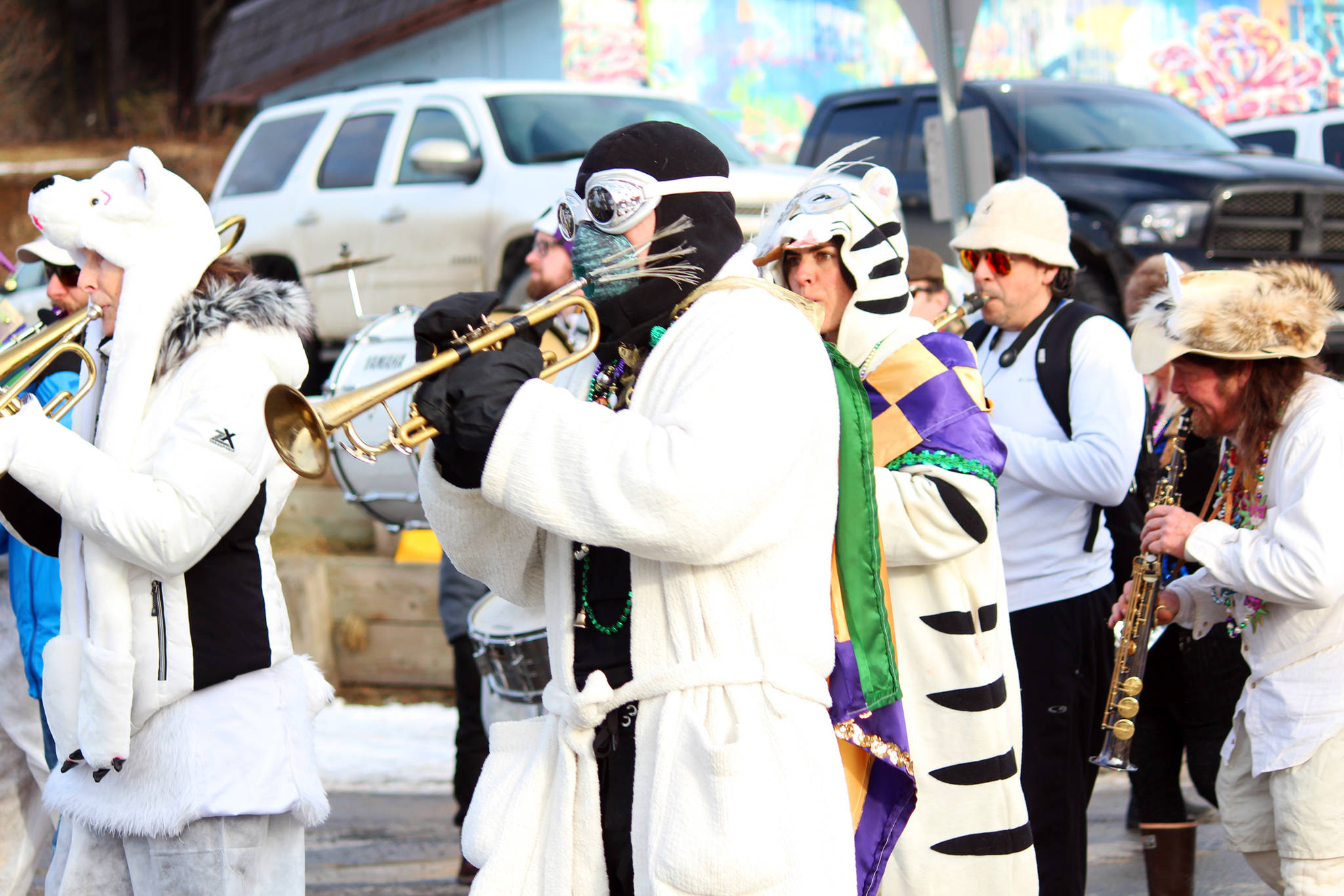 A trumpet player in full costume marches along with the rest of the Bossy Pants March Band in this year’s Winter Carnival parade Saturday, Feb. 10, 2018 down Pioneer Avenue in Homer, Alaska. (Photo by Megan Pacer/Homer News)