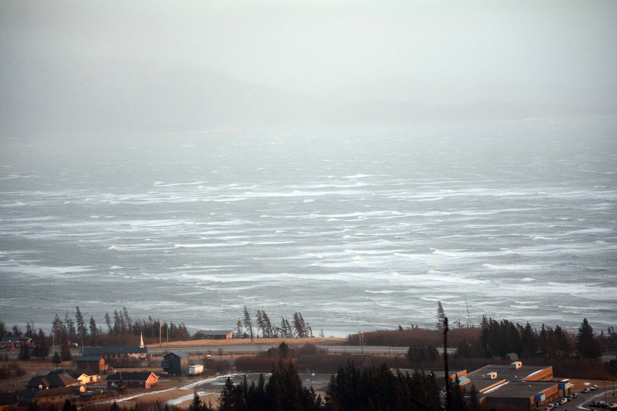 High waves blow on Kachemak Bay about 6 p.m. Monday, Feb. 26, 2018 as seen from West Hill Road in Homer, Alaska. The storm caused power outages on the lower Kenai Peninsula and high winds caused drifts on area roads, including Ohlson Mountain Road. (Photo by Michael Armstrong/Homer News)