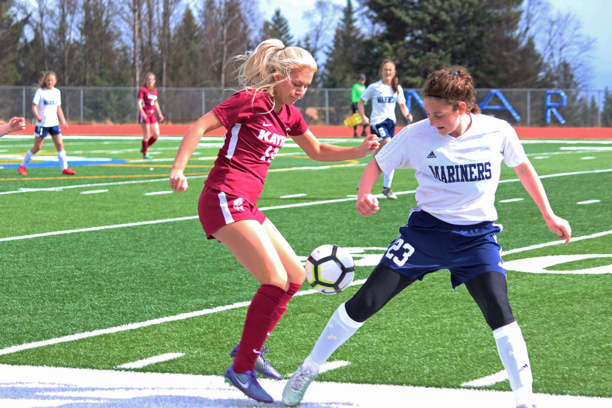 Ketchikan’s Leah Benning battles for control of the ball with Homer’s Rylyn Todd during their game Friday, May 4, 2018 at Homer High School in Homer, Alaska. Ketchikan won the match 2-1. (Photo by Megan Pacer/Homer News)