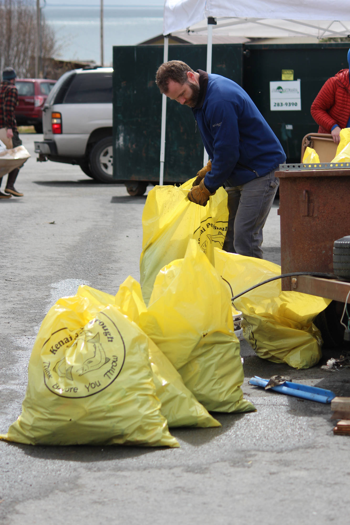 Volunteers help sort bags of trash cleaned from around Homer on Saturday, May 5, 2018 during the city’s annual Clean Up Day in Homer, Alaska. The Homer Chamber of Commerce gives out prizes to the those who collect the most bags of trash in different categories. (Photo by Megan Pacer/Homer News)