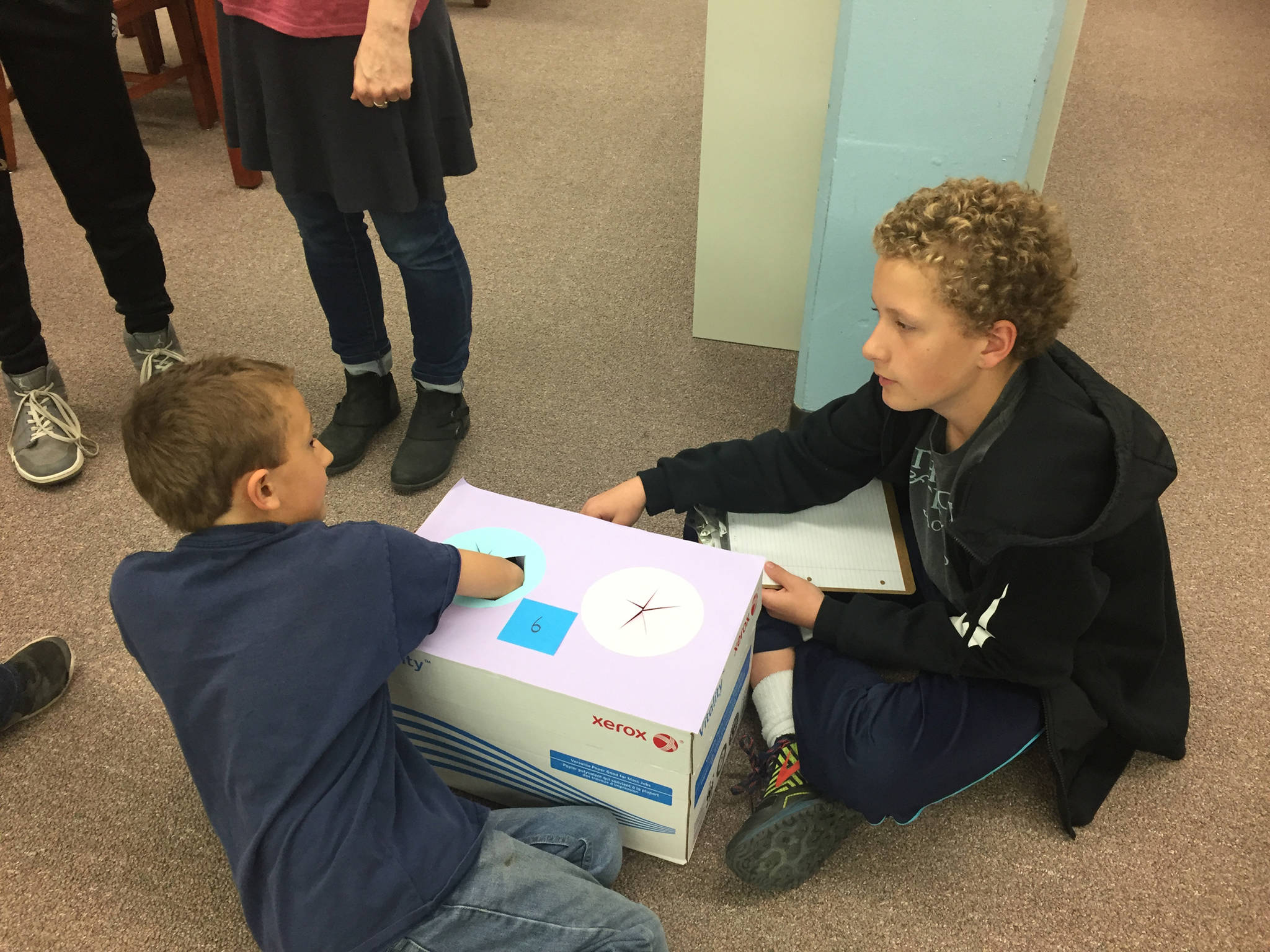 Zach and Andrew Marley work together at a discovery box during the last mentoring session of the year between students from Homer Middle School and Paul Banks Elementary School on Monday, May 14, 2018 at the middle school in Homer, Alaska. (Photo provided)