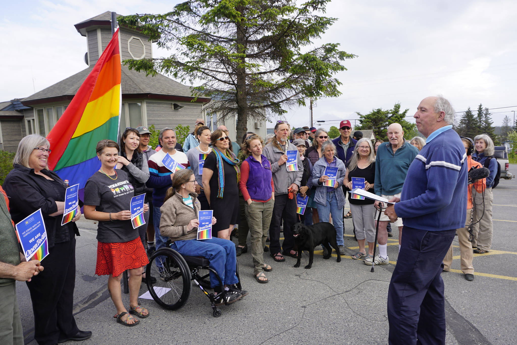 Homer Mayor Bryan Zak reads a Mayoral Recognition recognizing June as Homer Pride Month at about 6 p.m. Monday, June 11, 2018 outside Homer City Hall in Homer, Alaska. That is the time a regular city council meeting had been scheduled to take place. A crowd of about 75 people attended in support of Pride Month. Council members Shelly Erickson, Heath Smith and Thomas Stroozas notified the city clerk that they would not attend the June 11 meeting, forcing its cancellation because of lack of a quorum. (Photo by Michael Armstrong/Homer News)