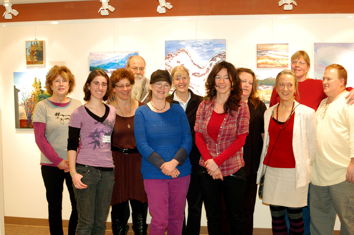 Some of the students in Asia Freeman’s Kachemak Bay Campus painting and drawing class pose with her at a reception on Nov. 20 at the college. From left to right are Shirley Coursey, Shannon Cefalu, Melody Barrett, Stan White, Rita Pfeninger, Nell Gustafson, Freeman, Karen Holbrook, Debbie Poore, Carol Beverly and Chris Beverly. Not shown is Oceana Wills. Coursey, White and Holbrook are in Freeman’s drawing class, but did not have work in the show.-Photo by Michael Armstrong, Homer News