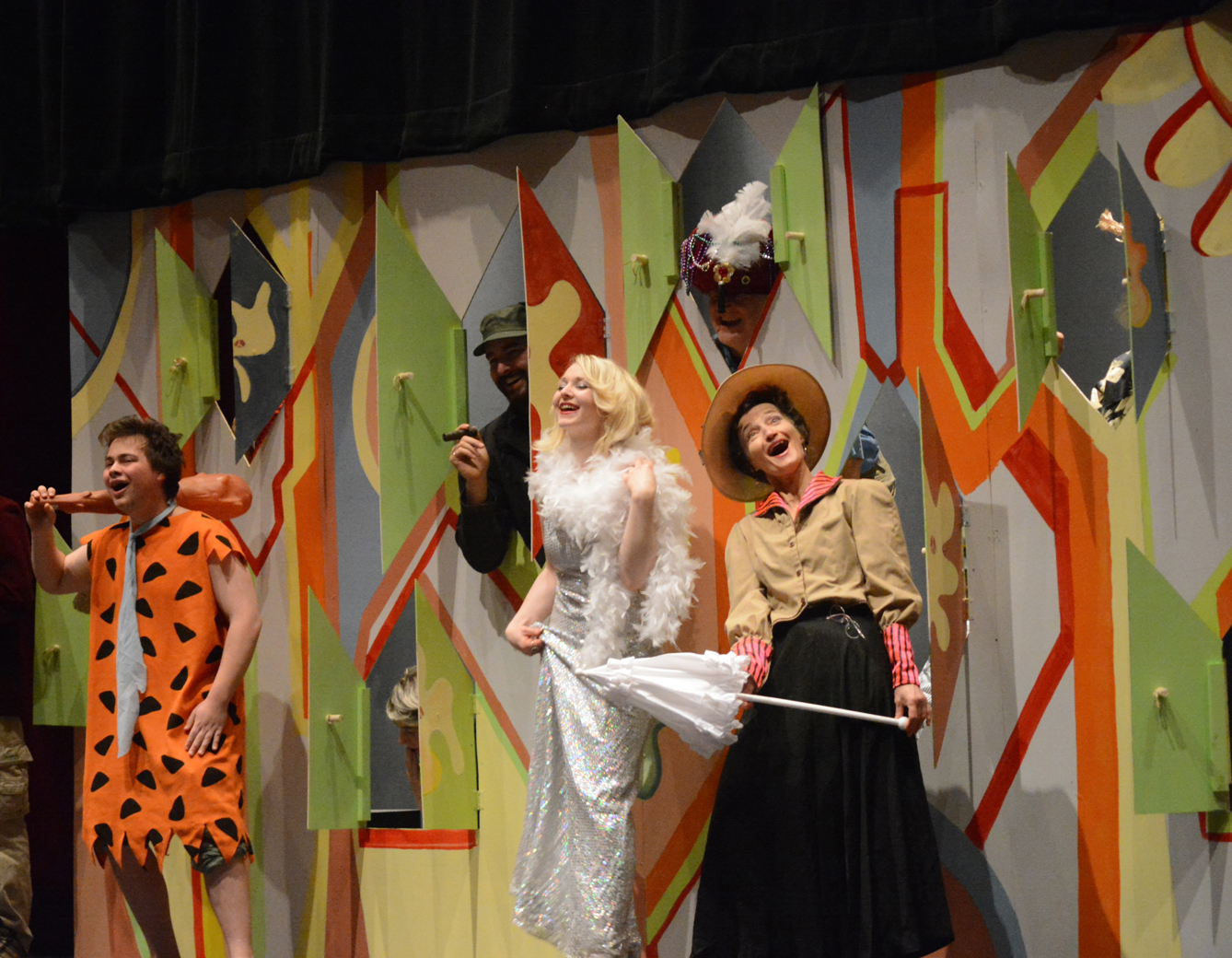 Some of the cast of “The ’60s Show” ham it up in rehearsals Monday at the Mariner Theatre. From left to right are Nolan Bunting, Michael Hurd, Bobbye Tripplet Hurd, Daniel Wysocki and Sunrise Sjoeberg. The set is a reproduction of the “Laugh-In” wall from the 1960s comedy variety TV show.-Photo by Michael Armstrong, Homer News