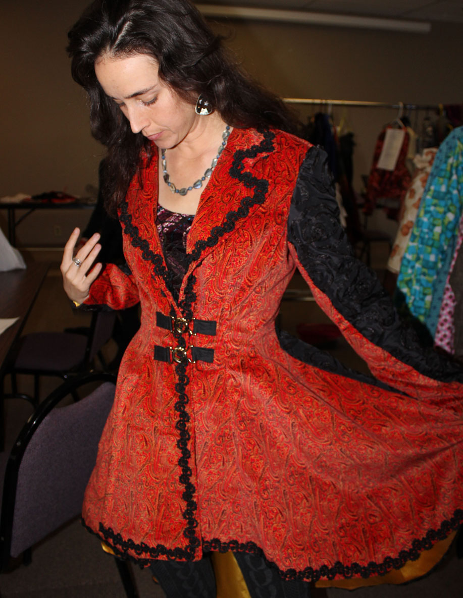 Models try on some of the pieces that will be featured in Saturday’s Wearable Arts show. Decker models a masquerade jacket created by Risa Jackinsky.-Photo by McKibben Jackinsky, Homer News