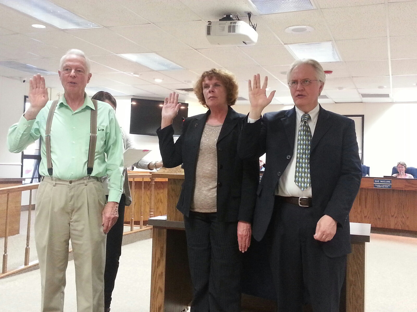 The three newly elected Kenai Peninsula Borough Assembly members are sworn in to office at Tuesday’s assembly meeting in Soldotna. From left are Stan Welles, who will replace Charlie Pierce in the Sterling and Funny River district; Kelly Cooper, who will replace Bill Smith for the Homer district seat; and Blaine Gilman, who will replace outgoing Kenai district member Hal Smalley.-Photo by Dan Balmer, Morris News Service - Alaska