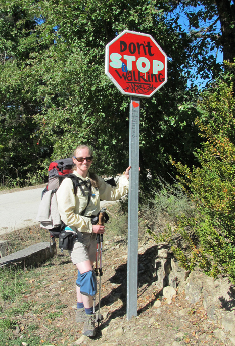 Christina Whiting poses by a “Don’t Stop Walking” sign during her adventure on the El Camino de Santiago.-Photo by Christina Whiting