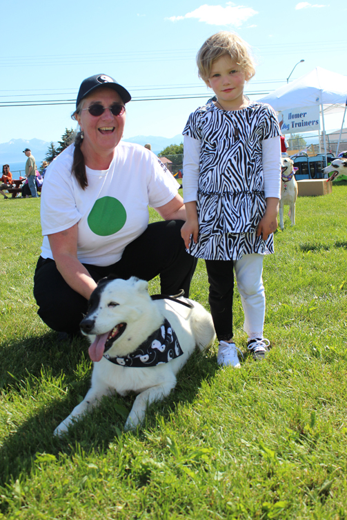 Yang, Bonnie Betley and her granddaughter Kaia Borba bask in  their “best owner-dog look alike” glory.-Photo by McKibben Jackinsky, Homer News