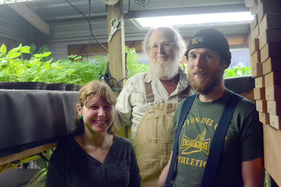 From left to right, Jenni Medley, Tony Burgess and Beau Burgess stand by aquaponic vegetatble beds at the Burgesses’ Shellfish Avenue home.-Photo by Michael Armstrong, Homer News