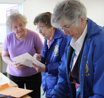 Lorraine Haas, Lorene Tepa Hansen Rogers and Joan Gordon Edens compare stories.-Photo by McKibben Jackinsky, Homer News