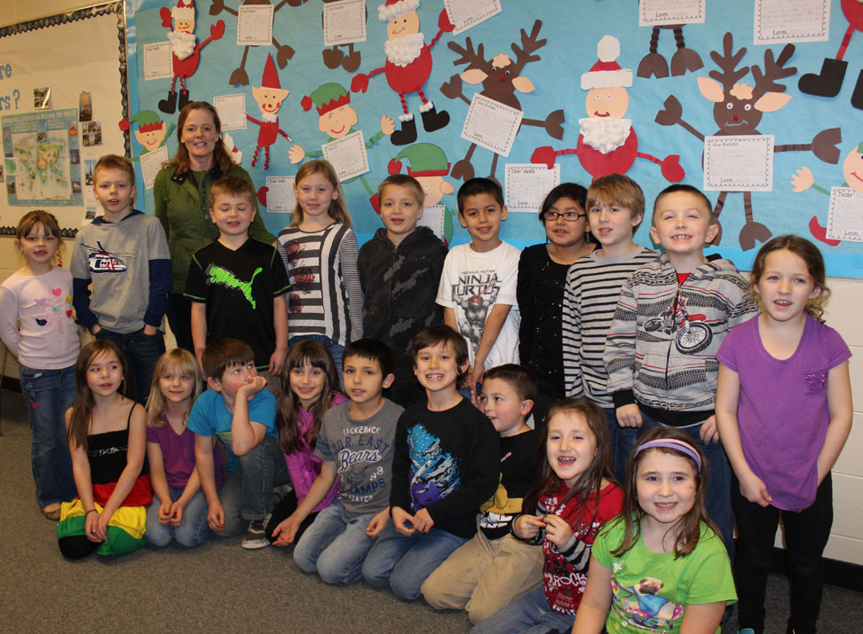 Standing before a display of their holiday letters are students in Kari Greiner’s second-grade class at Paul Banks Elementary School. From left, front row: Aria Hill, Aerial Kepler, Dallas Walker, Natalie Keintz, Tristan Demlow, Mark Rader, Mason Watson, Hailey Van Sandt, Miriah Gassler; back row: Caitlyn Rogers, Brady Coppo, teacher Kari Greiner, Preston Stanislaw, Jaklyn Bishop, Jaydan Stanish, Talien Sanchez, Diamond Ojeda, Wade Benjamin, Kaleb Worland and Natalie Roy.-Photos by McKibben Jackinsky, Homer News