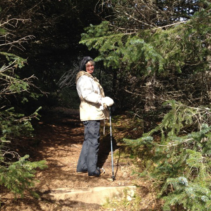 Meta DeArmoun gets her steps in as part of a nine-week walking challenge. Seldovia’s forests and beaches provide incredible views while residents walk as part of a nine-week challenge.-Photo by Laura Hilts