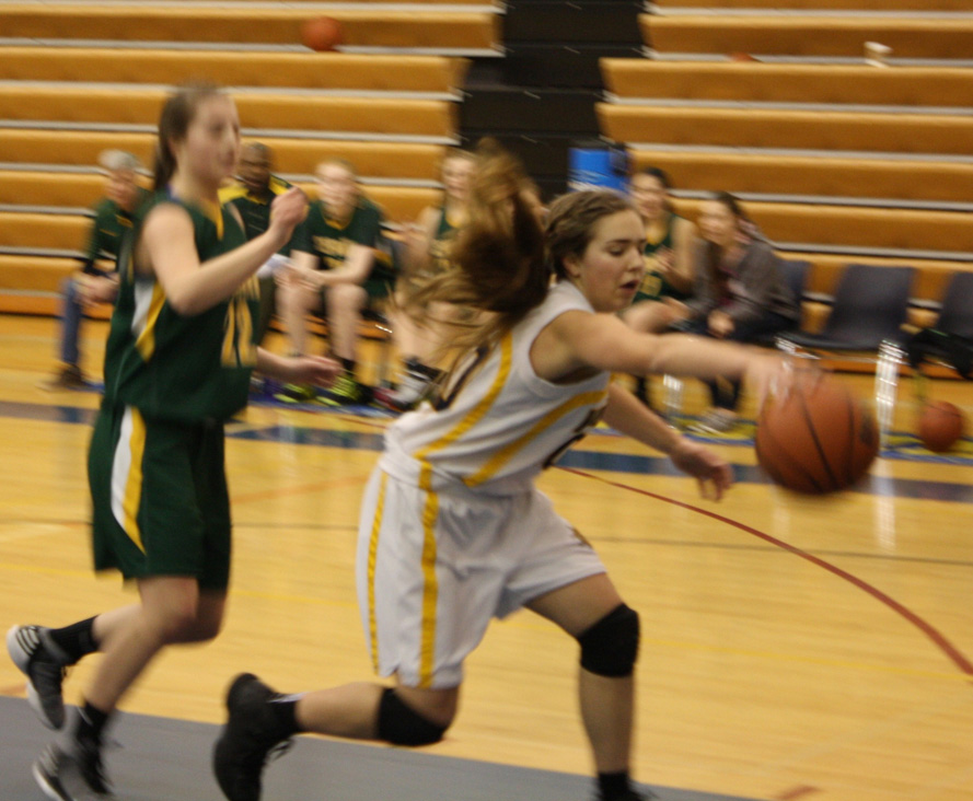 Mariner Aurora Waclawski keeps the ball in play during a game against the Seward Seahawks.-Photo by Lindsay Olsen