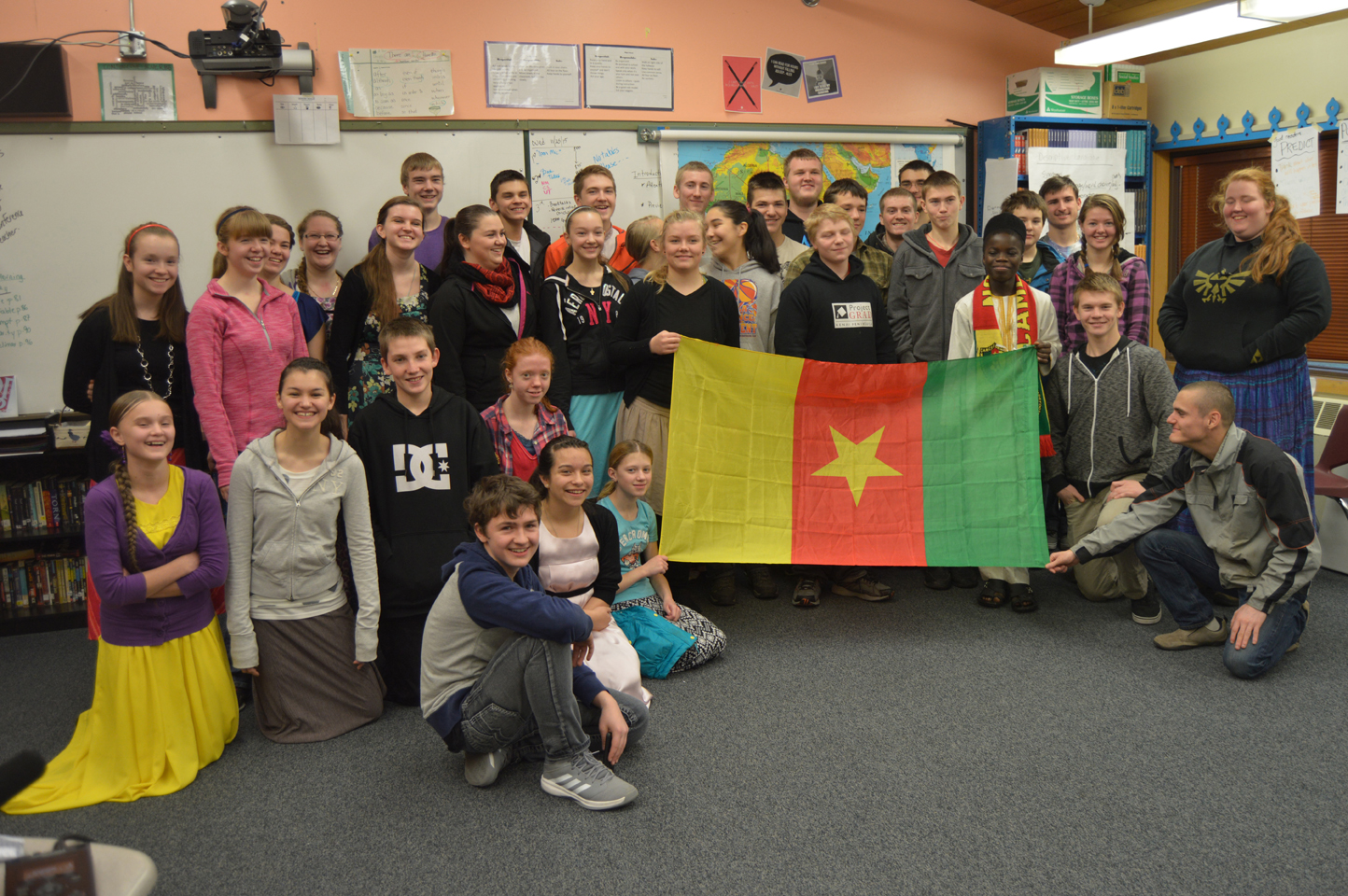 The high school students at Nikolaevsk School pose with Nouredine Mama, an exchange student from Cameroon in Homer for the year.-Photo by Annie Rosenthal