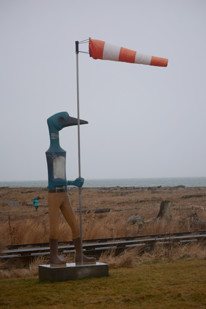 The windsock on Rachelle Dowdy’s loon sculpture is almost straight out in high winds at Bishop’s Beach on Monday afternoon.-photo by Michael Armstrong