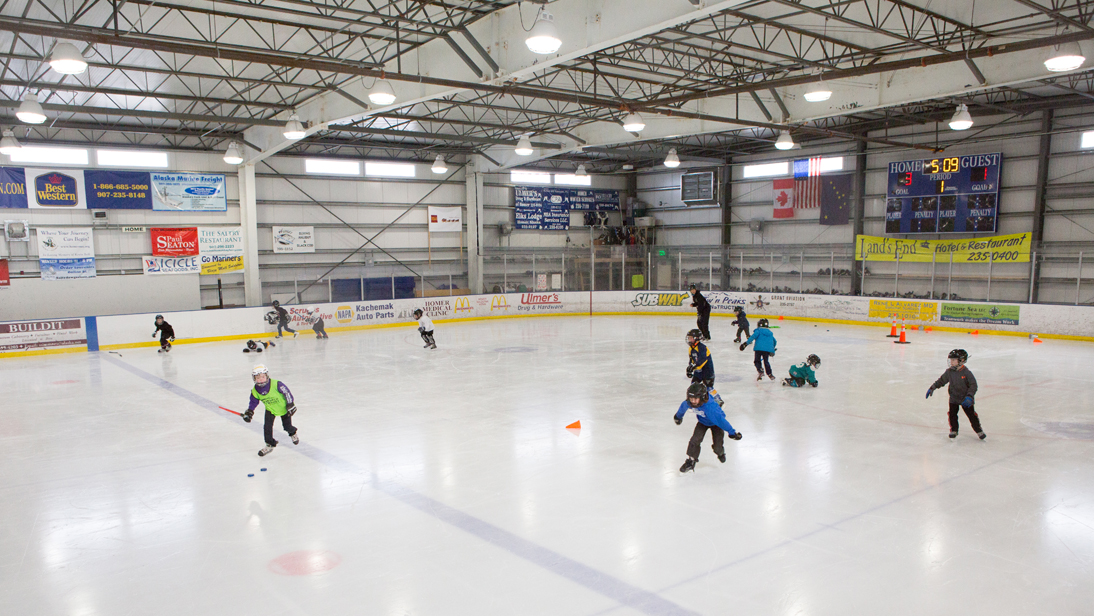 The Kevin Bell Mites take to the ice Sunday during Kevin Bell Day. Bell, who died in 2008, was a driving force behind Homer hockey.-Photo by Aaron Carpenter, Homer News