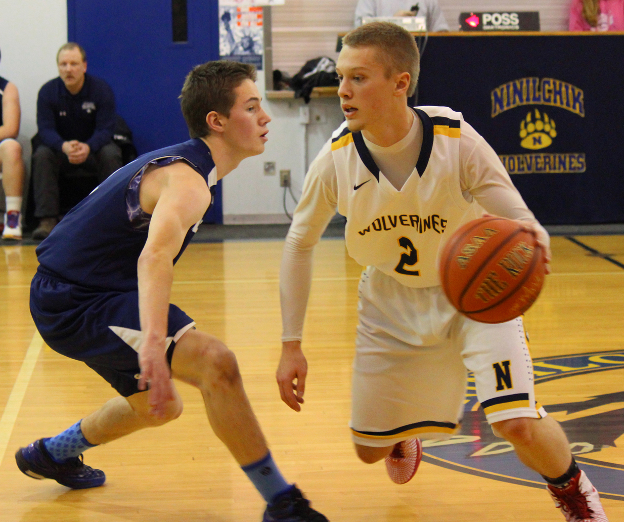 Ninilchik’s Tyler Presley maneuvers around a SoHi JV player during the championship game in the Ninilchik Invitational Basketball Tournament on Saturday. SoHi won the game 76-66, and the tournament, with Ninilchik in second place.-Photos by McKibben Jackinsky, Homer News