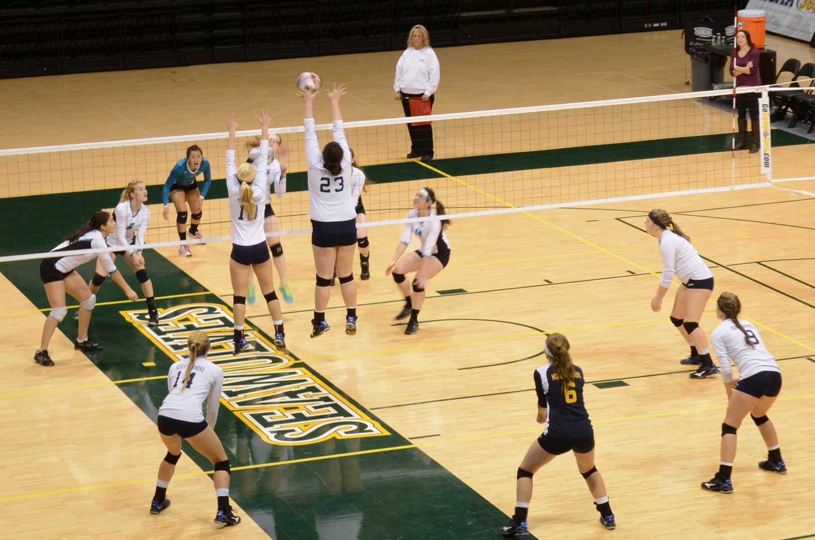 The Mariners hold a tough defense as Kyla Pitzman (23) and Jane Rohr (10) jump to block Nikiski in Match 9 of the tournament at the Alaska Airlines Center. Pitzman and Rohr were both named to the 2014 State All-Tournament team.-Photo by Stephanie Pitzman