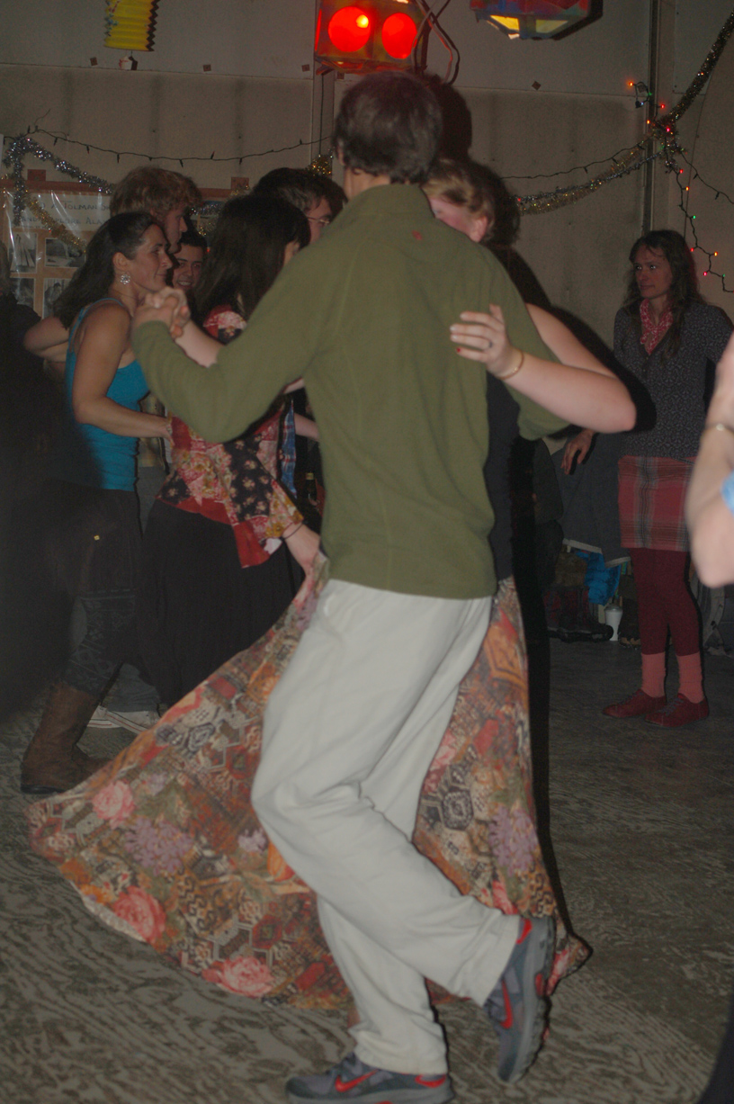 New Year’s Eve revelers dance at a contra dance party at Renn Tolman’s boat shop last year.-Michael Armstrong