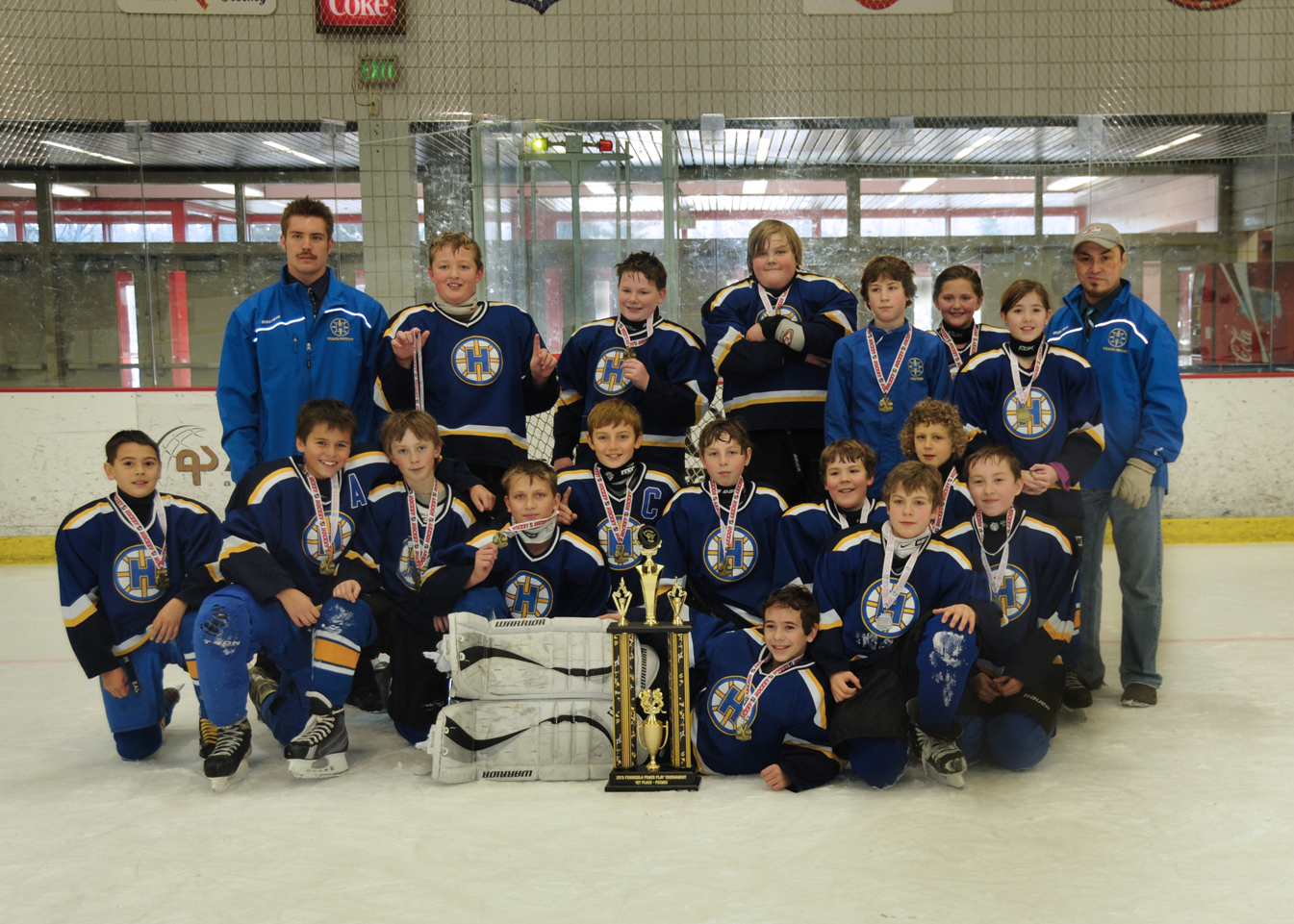 Homer’s Squirt C team shows off their Power Play Tournament championship trophy.-Photos by Stephanie Pitzman