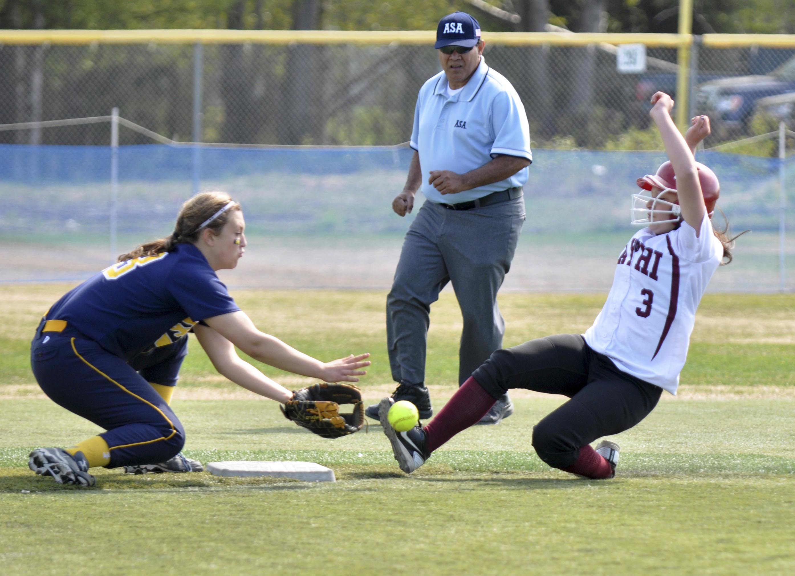 Ketchikan’s Felicia Ruaro, right, slides safely into second base as Homer’s Miranda Beach attempts to field the ball and make the tag during the small schools state softball tournament Friday, May 31 at Cartee Fields in Anchorage.-Photo by Mike Nesper/Morris News Service - Alaska