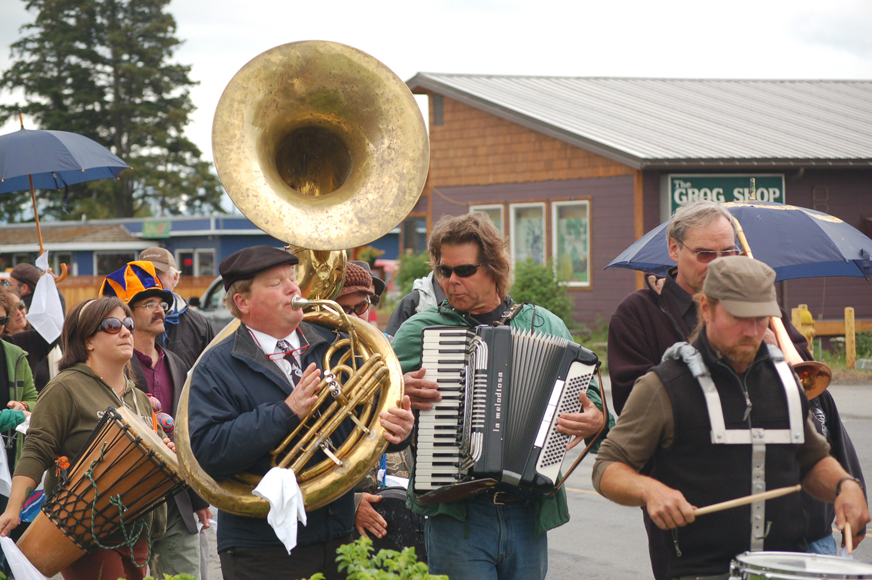 The Bossy Panties dancers and the Bossy Pants band and friends and family of Ray Garrity hold a second-line procession down Pioneer Avenue on Monday afternoon.-Photo by Michael Armstrong, Homer News