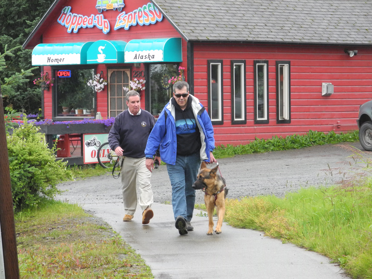 Rick Malley, right, walks his new guide dog as Fidelco instructor Peter Nowicki, left, watches.-Photo by Michael Armstrong, Homer News