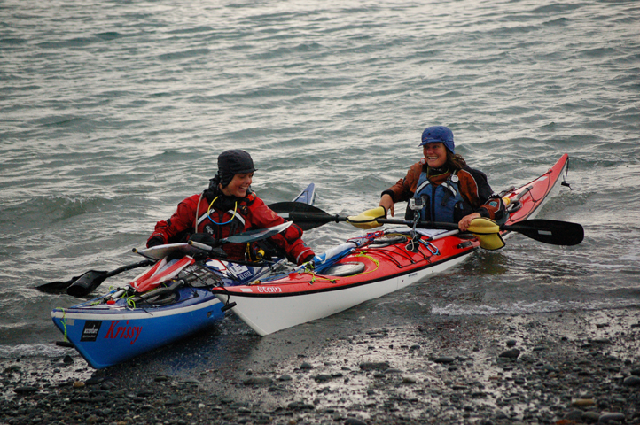 Sarah Outen and Justine Curgenven land on the Homer Spit at 8:15 p.m. Thursday, Aug. 14, after a 101-day, 1,300-mile kayak journey from Adak.-Photo by Michael Armstrong, Homer News