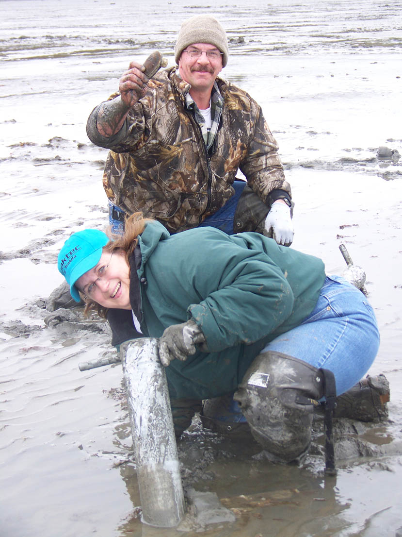 Al and Tanjala Eischens of Wasilla use a clam gun to fill their bucket with clams in Ninilchik during the summer of 2008.-Homer News file photo