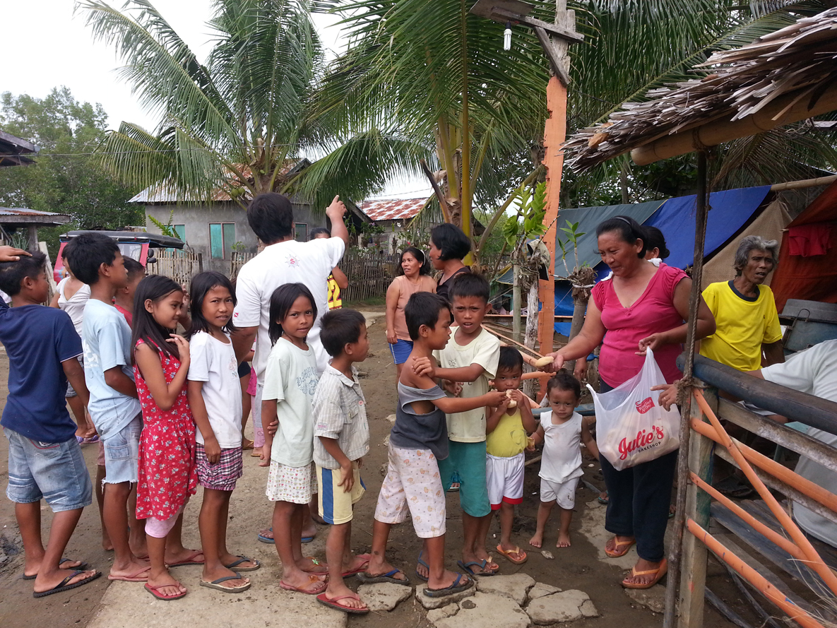 Children line up to receive food following the Oct. 15 earthquake in the Philippines.-Photo courtesy of Nathaniel Brown