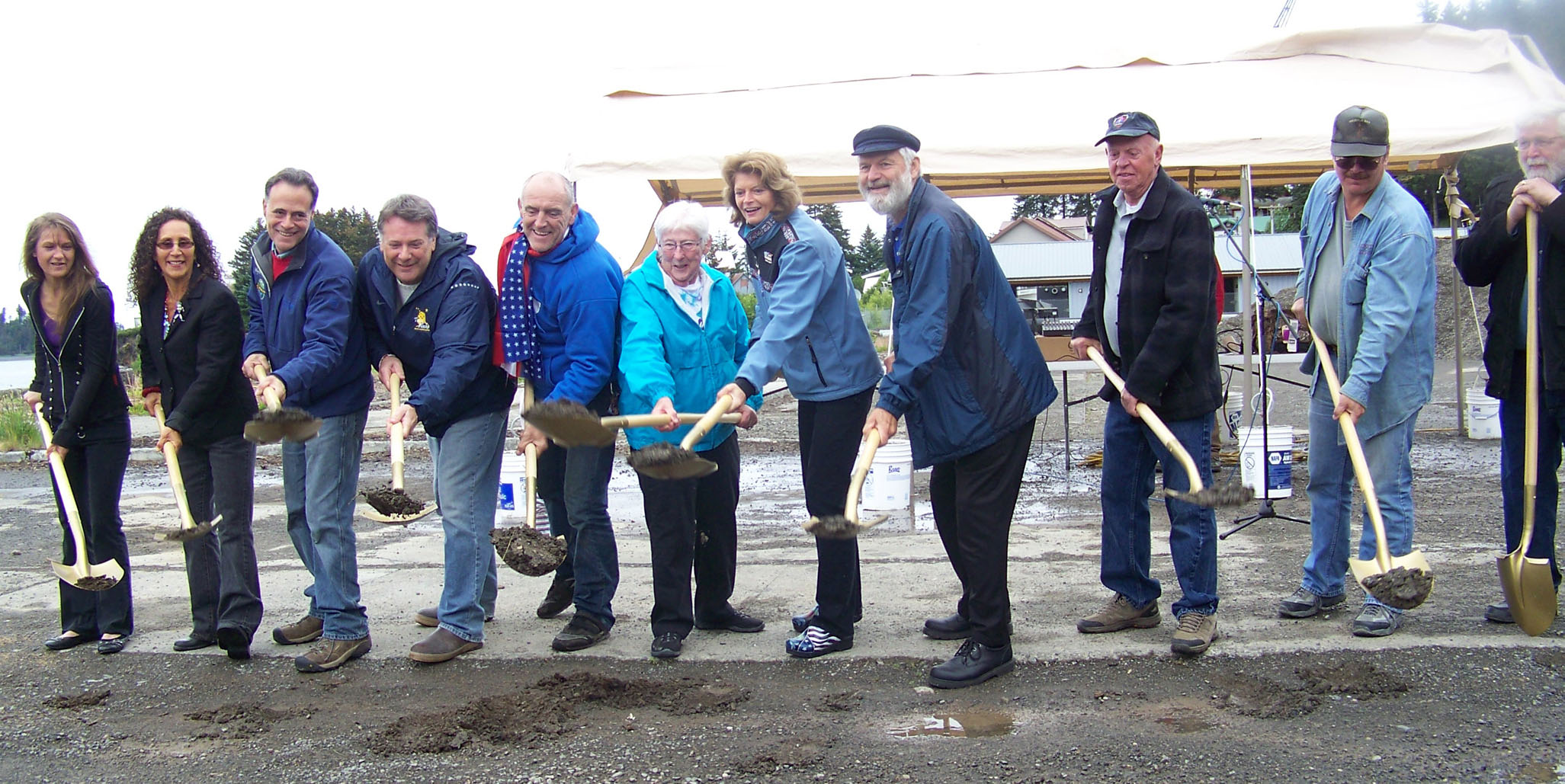 A July 4 groundbreaking ceremony in Seldovia marks the beginning of construction for a value-added processing plant that, once built, will be leased by the city to Seldovia Wild Seafood. Jay-Brant General Contractors of Homer is the lead contractor on the 100-by-60-foot building. Participating in the event were, from left, Ronene Gain, wife of Seldovia mayor Keith Gain; Vivian Rojas, Seldovia City Council; Sen. Peter Micciche, R-Soldotna; Tim Dillon, Seldovia city manager; Michele Bieri, Seldovia Wild Seafood; Geraldine Patrick, city council; U.S. Sen. Lisa Murkowski; Rep. Paul Seaton, R-Homer; Dean Lent, city coucil; John Colberg, city council; and John Torgerson, executive director, Kenai Peninsula Economic Development District.-Photo by McKibben Jackinsky, Homer News