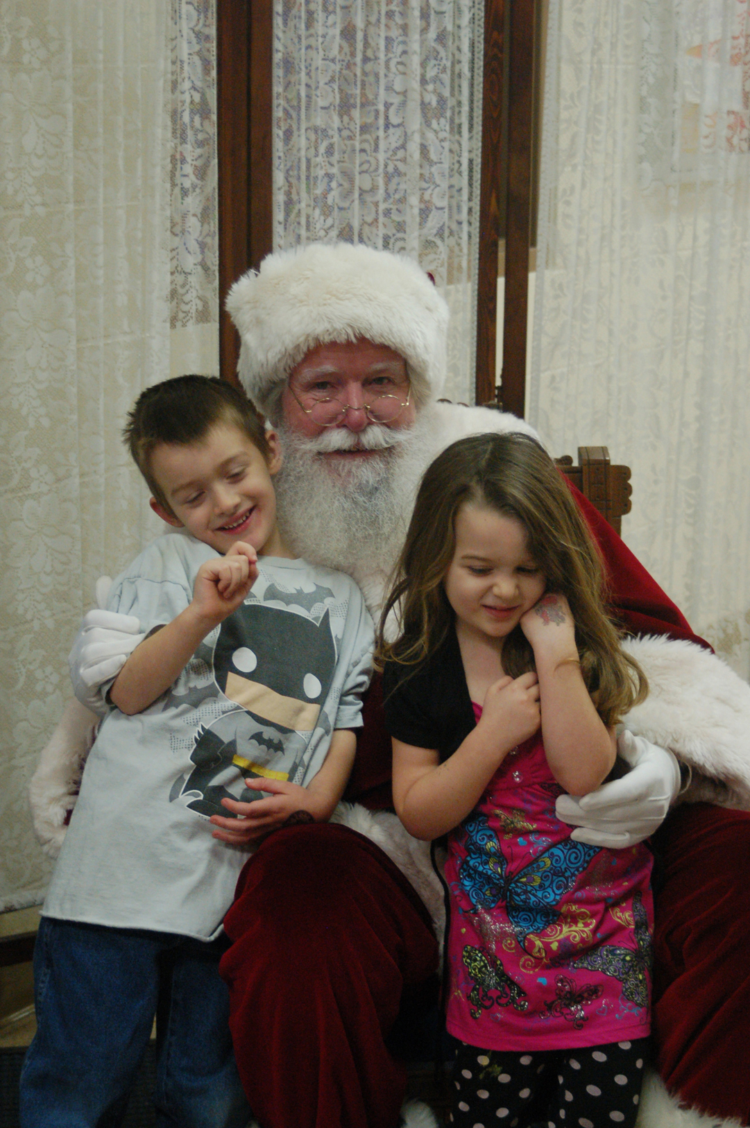 Finnegan Mattingly, left, and Diana Mattingly pose for a photograph with Santa Claus at the Nutcracker Faire last Saturday.-Photo by Michael Armstrong, Homer News