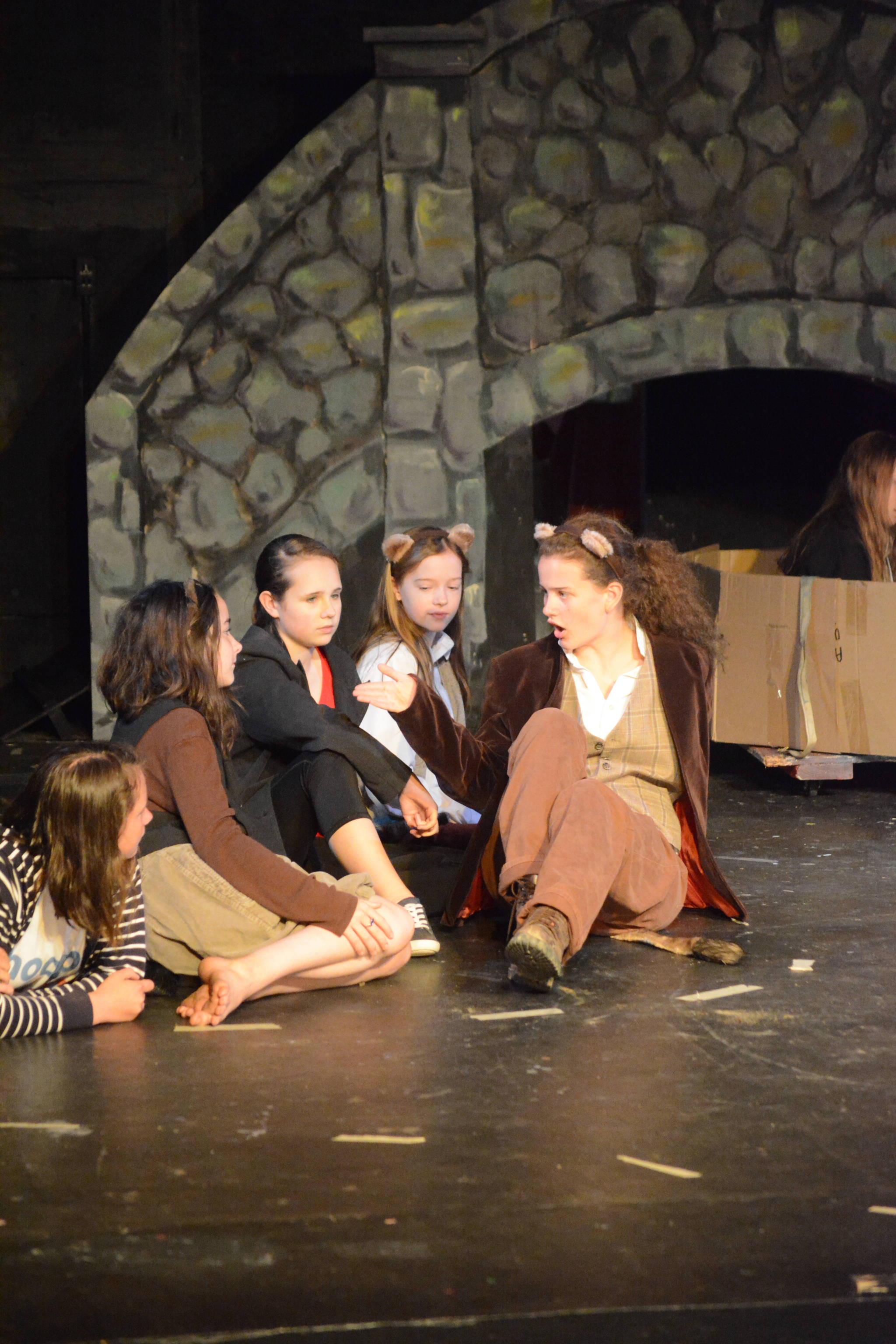 Indigo Sonnenborn, far right, rehearses a scene from “The Wind in the Willows.” Joining her are, from left to right, Thea Person, Esme Golden, Elsa Pietsch and Poppy Smith. The Pier One Youth Theatre play shows Thursday through Sunday, Aug. 9-12, 2018, in Homer, Alaska. (Photo by Michael Armstrong/Homer News)