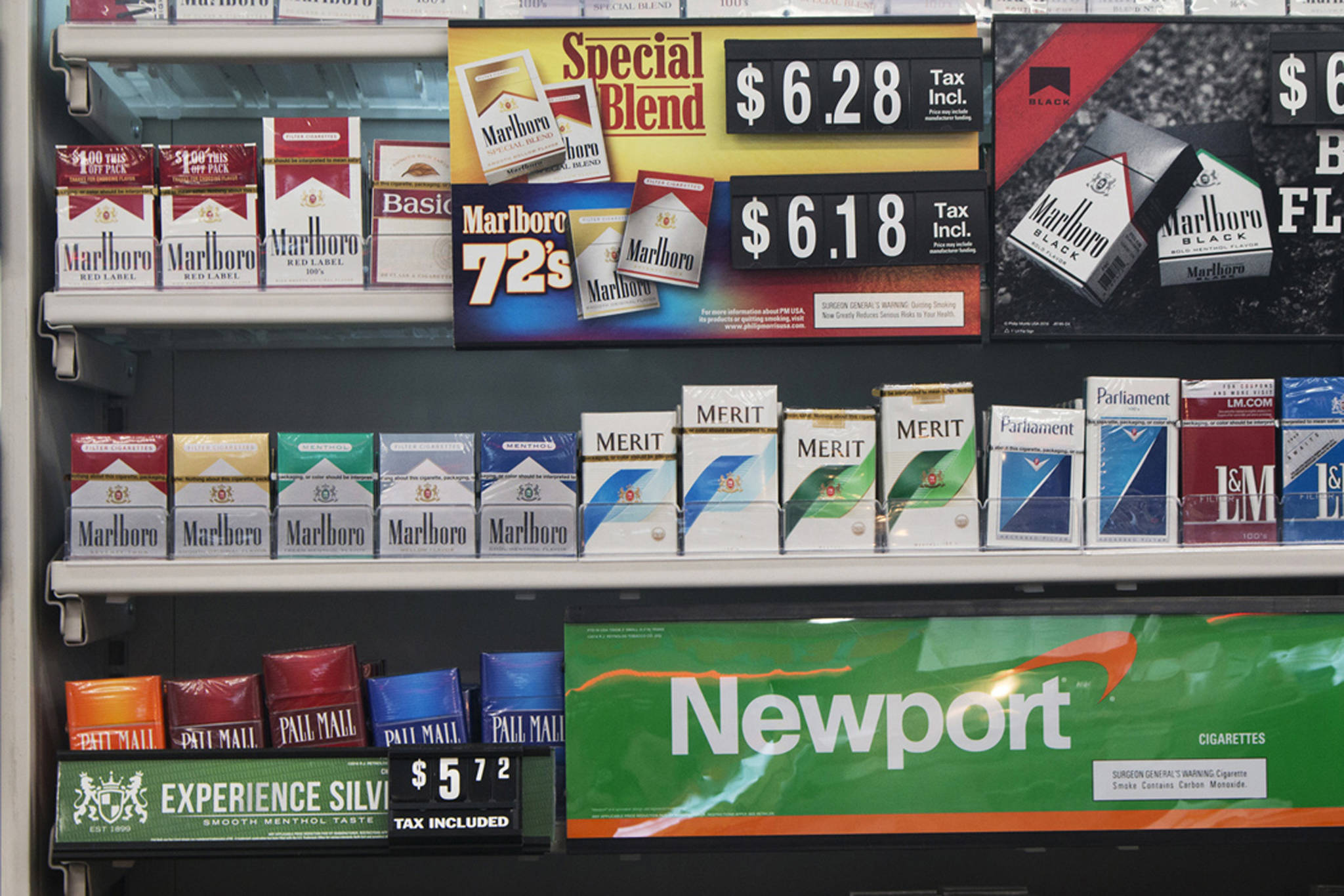 In this Thursday, May 18, 2017 file photo, packs of cigarettes are offered for sale at a convenience store in Helena, Mont. Tobacco companies have made claims about cigarettes since the 1950s, all later proven false. In some cases the introduction of these products, such as filtered and cigarettes, propped up cigarette sales and kept millions of Americans smoking. Although the adult smoking rate has fallen to an all-time low of 15 percent in 2017, smoking remains the nation’s leading preventable cause of death and illness, responsible for about one in five U.S. deaths. (AP Photo/Bobby Caina Calvan)