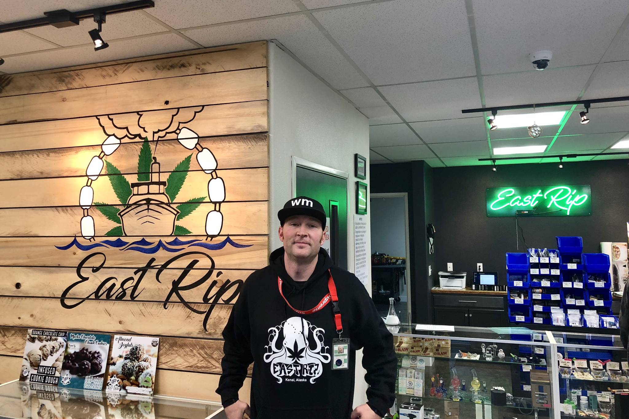 Ryan Tunseth stands at the counter of his business, East Rip, on Monday in Kenai. (Photo by Victoria Petersen/Peninsula Clarion)