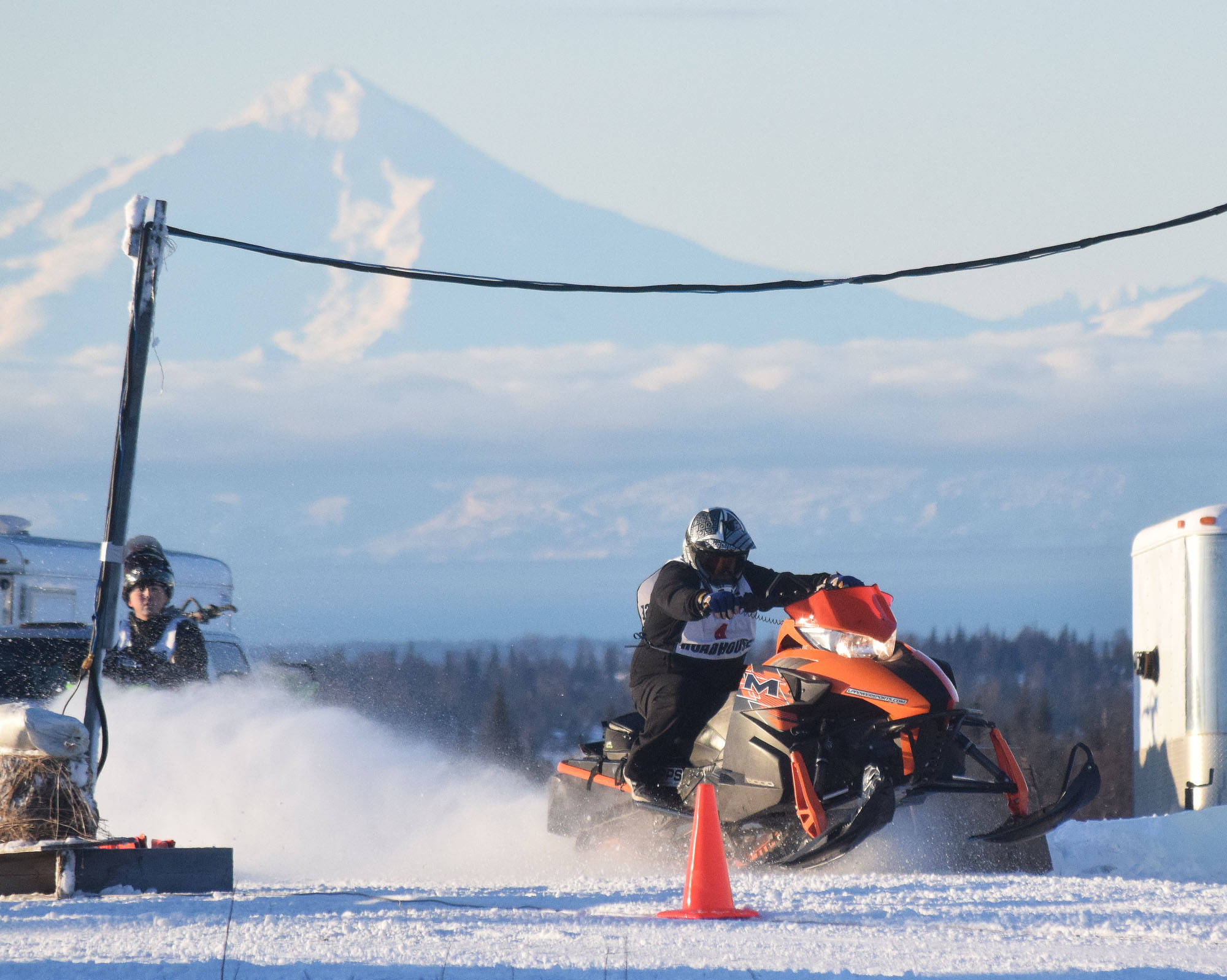 <span class="neFMT neFMT_PhotoCredit">Photo by Joey Klecka/Peninsula Clarion</span>                                George Derkevorkian takes off at the start of a drag heat Saturday afternoon at the snowmachine drag races at Freddie’s Roadhouse near Ninilchik.