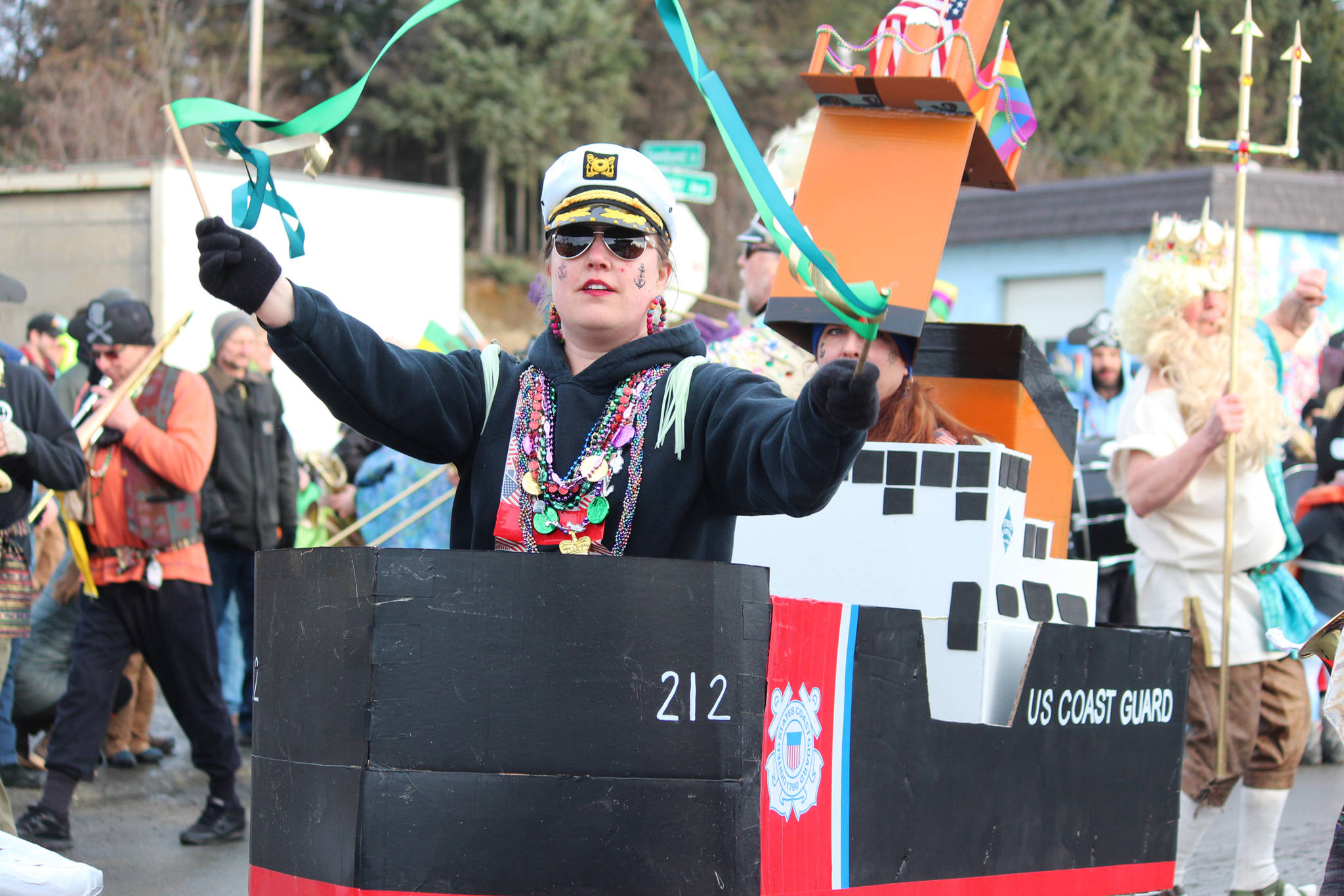 A marcher with the Krewe of Gambrinus dances during the Winter Carnival Parade on Saturday, Feb. 9, 2019 in Homer, Alaska. (Photo by Megan Pacer/Homer News)