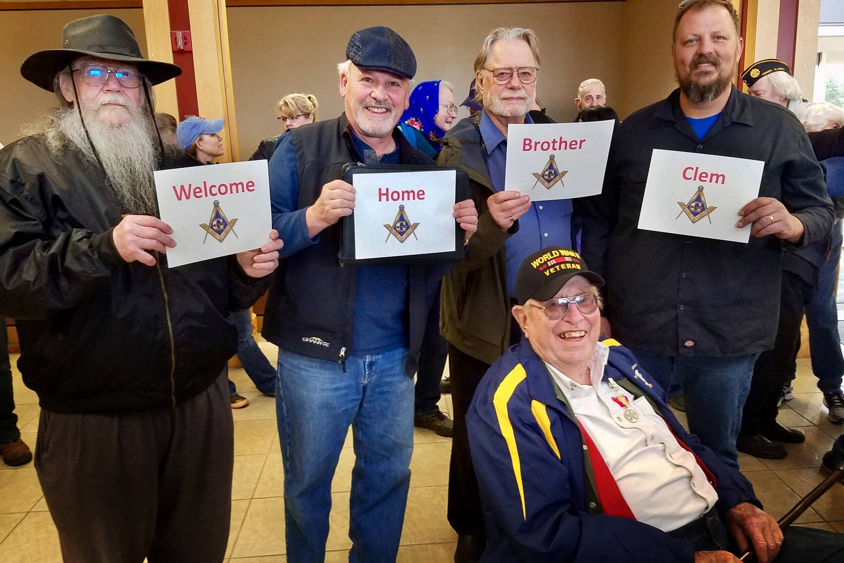 Members of the Homer Masonic Lodge turned out last Saturday, May 4, 2019, to honor World War II veteran Clem Tillion after his return on a Last Frontier Honor Flight. They also showed appreciation for his many years of Masonic service. In the photo standing behnd Tillion are, left to right, are Grady Svoboda, Tom Stroozas, Dave Spell and Greg Martin. Tillion took part in the Last Frontier Honor Flight, a trip that takes Alaska veterans to Washington, D.C. to see the sites and take in the memorials built in their honor . “It’s nice that they remember,” said Clem Tillion, a World War II veteran and former state lawmaker. Tillion remembers the war as well as anyone. As part of the Marine Corps in World War II, his journey took him to the Pacific Theater in Samoa, Guadalcanal, and elsewhere looking for unexploded ordnances. “Freedoms are won by somebody that goes out and fights for it. You don’t have anything without it,” said Tillion. “I don’t think I’m anything spectacular. I just went in, did it, and came out alive.” Tillion made the trip with mostly Korea and Vietnam veterans, 23 total on the flight. He was one of four World War II veterans on the trip. (Photo provided)